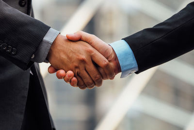 Cropped image of businessmen shaking hands