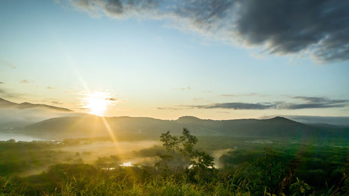 Scenic view of landscape against sky during sunset