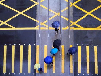 Directly above shot of people walking on street during monsoon