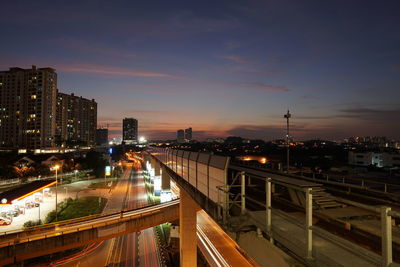 High angle view of illuminated buildings in city at night