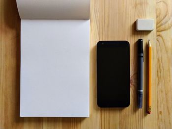 High angle view of smart phone on table