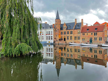 Brugges, the refection of the building and the tower in the water