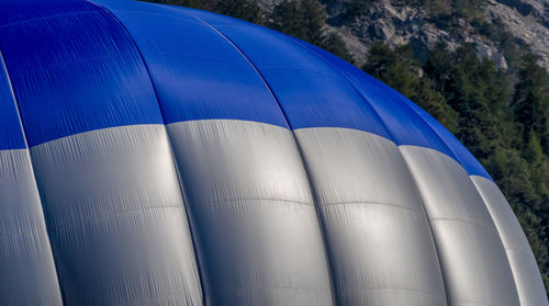 Low angle view of hot air balloon against blue sky