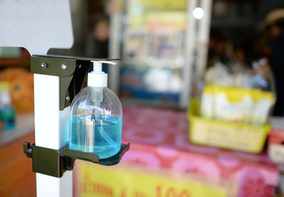 Close-up of bottles on display at store