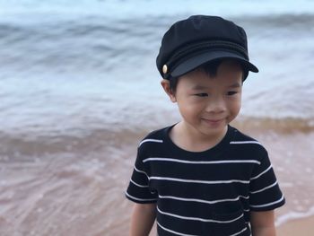 Boy wearing sunglasses on beach