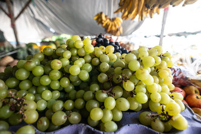Green grapes for sale at a street market. fruit source of antioxidants, vitamins and minerals. 