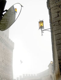 Low angle view of street light against sky