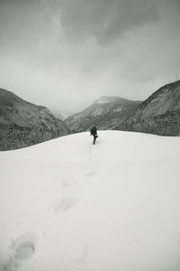 Full length of man on snowcapped mountain