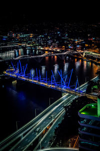 High angle view of illuminated bridge over river at night