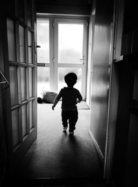 Boy playing in corridor