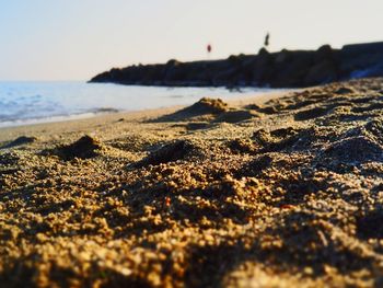 Surface level of beach against sky