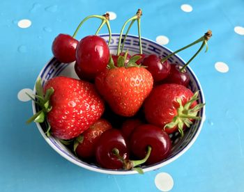 High angle view of strawberries in bowl on table