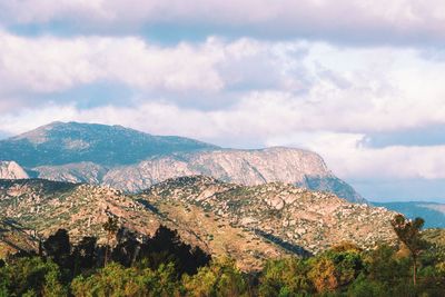 Scenic view of mountains against sky at sunset