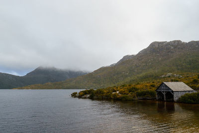 Scenic view of lake and mountains against sky