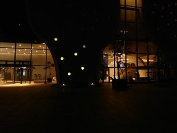 Reflection of illuminated lights in glass building