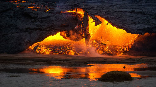 Lava flowing from the volcanic eruption in mt fagradalsfjall, southwest iceland. 