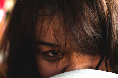 Close-up portrait of woman at home