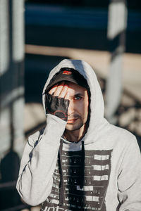 Portrait of young man wearing hat outdoors