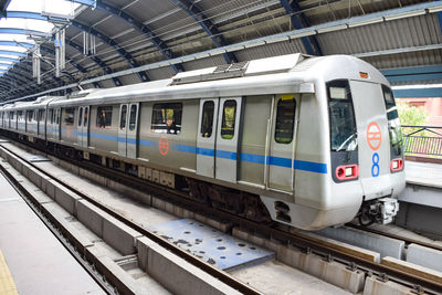 Delhi metro train arriving at jhandewalan metro station in new delhi, india, asia, public metro rail