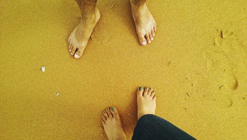 Low section of woman walking on tiled floor