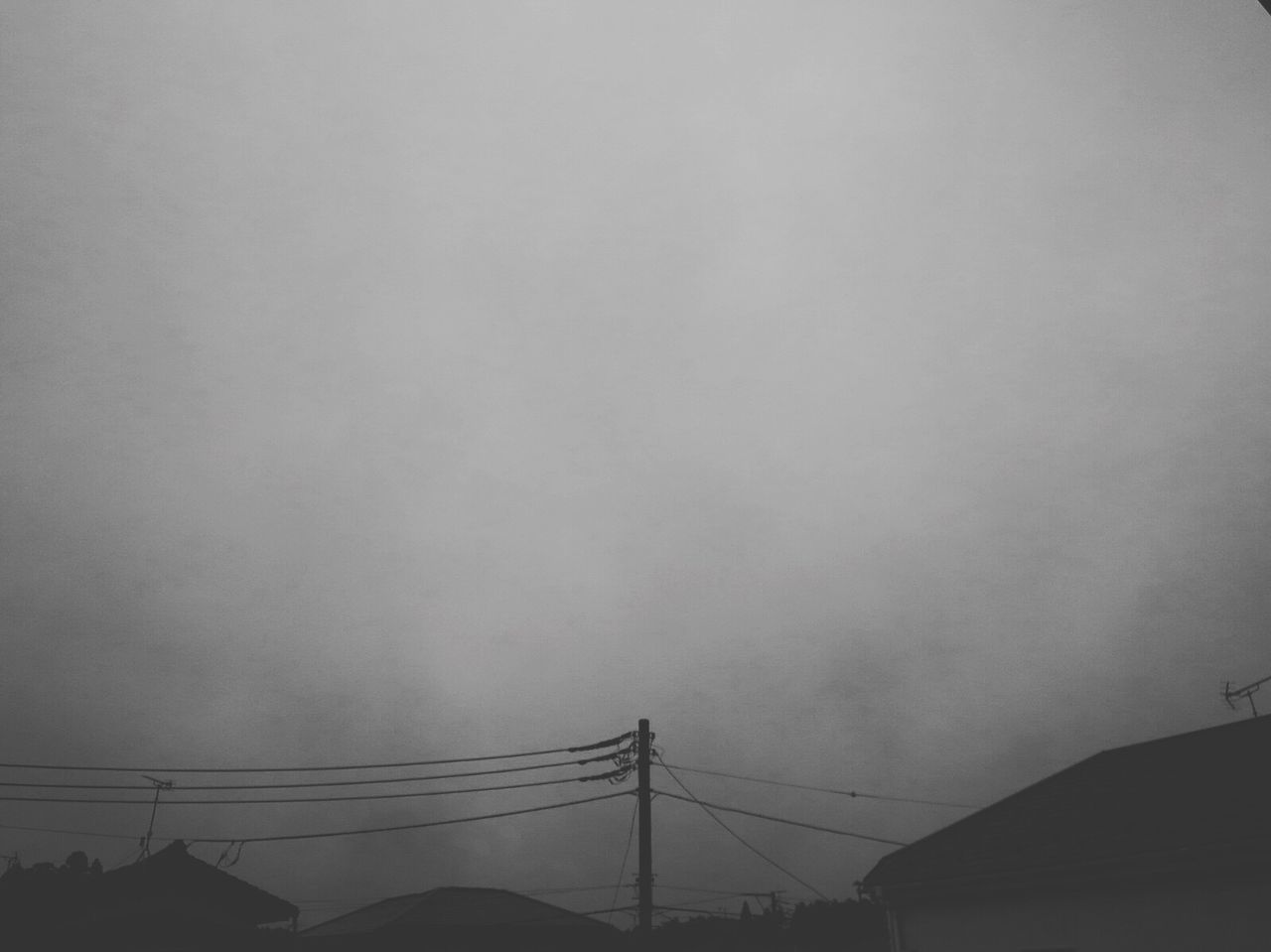 LOW ANGLE VIEW OF SILHOUETTE ELECTRICITY PYLONS AGAINST SKY