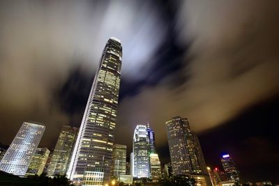 Low angle view of skyscrapers lit up at night