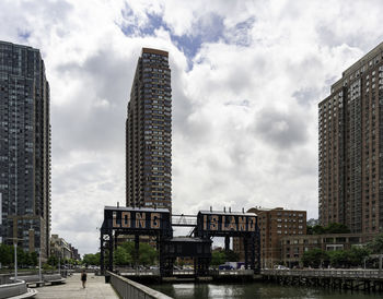 Modern buildings in city against sky