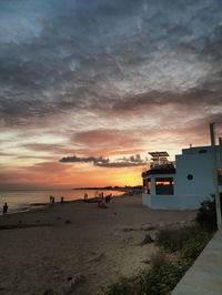 Scenic view of beach against sky during sunset