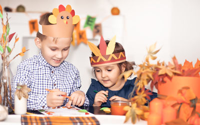 Cute kids drawing on envelope at home