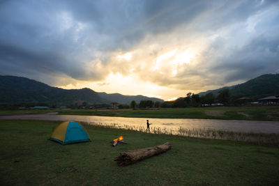 Scenic view of lake against sky during sunset