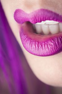 Close-up of woman with purple lips