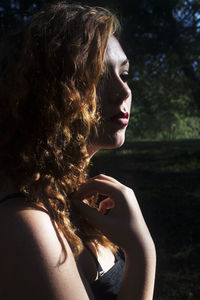 Close-up of young woman holding apple