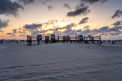 Scenic view of beach against sky during sunset