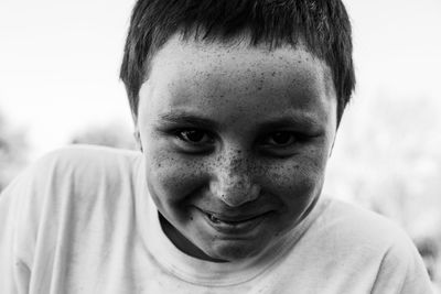 Portrait of smiling boy with freckled face