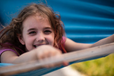 Portrait of smiling girl sitting in boat