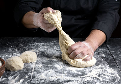 Midsection of chef preparing food