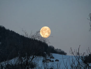 Scenic view of moon against clear sky at night