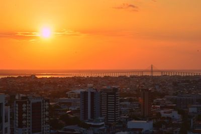 High angle view of buildings against sky during sunset