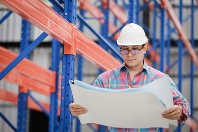 Portrait of man working at construction site