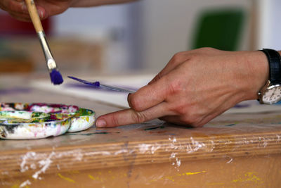 Close-up of woman hand on table