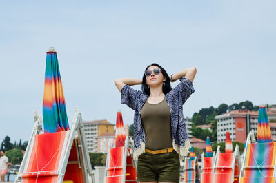 Portrait of woman standing against clear sky