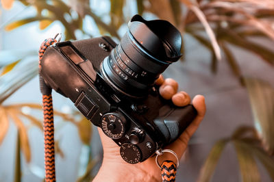 Close-up of hand holding camera