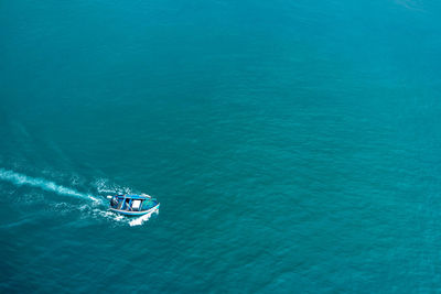 High angle view of boat sailing in sea