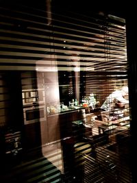 Reflection of illuminated window in store