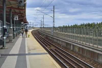 Railroad station platform against sky