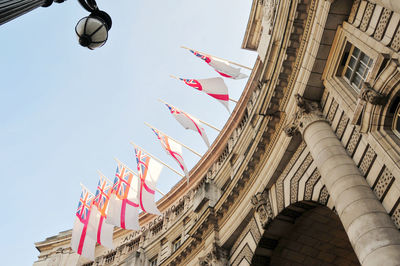 Photo of a row of english flags on buildings in london, england