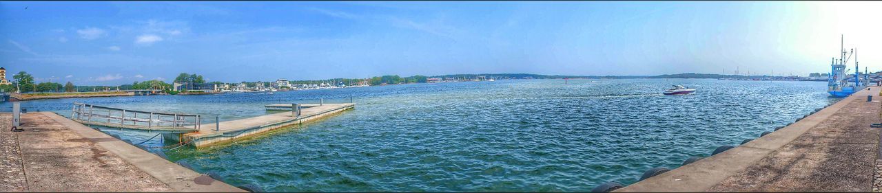 water, sea, nautical vessel, sky, pier, transportation, blue, moored, boat, tranquility, jetty, tranquil scene, harbor, mode of transport, built structure, nature, railing, scenics, day, beauty in nature