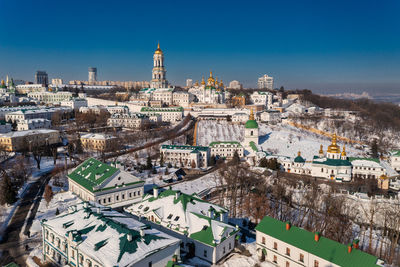 Beautiful winter top view of the kiev-pechersk lavra. many churches in the snow.