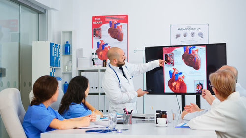 Female doctor working in office