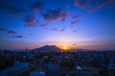 Aerial view of city at sunset